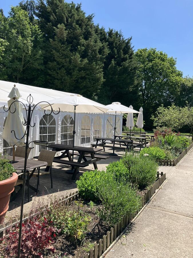 Marquee with flower beds